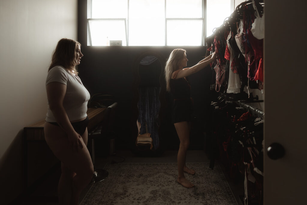 Sabrina helping a client choose an outfit at Apricot Aura Boudoir Photography near Melbourne